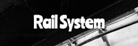 a black and white photo of a rail system