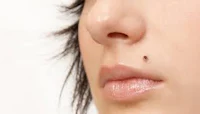 a close up of a woman's nose
