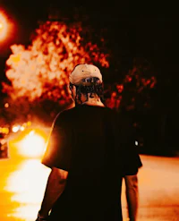 a man riding a skateboard on a street at night