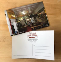 a postcard with a picture of a restaurant