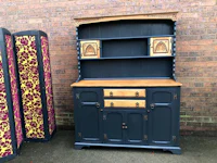 a blue and gold hutch with two doors