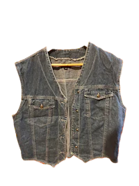 a denim vest on a black background