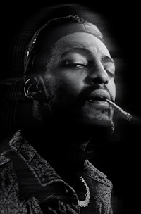 a black and white photo of a man smoking a cigarette
