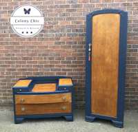 a blue dresser and chest of drawers next to a brick wall
