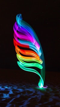 a colorful light sculpture in the sand