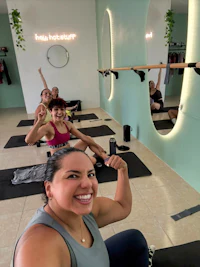 a group of women doing pilates in a gym