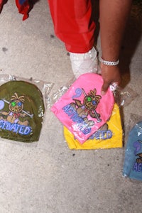 a person holding a bag of doughnuts