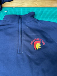 a blue hoodie with a red and yellow logo on it