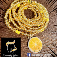 a yellow beaded bracelet with a lemon slice charm