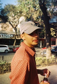 a man holding a can of soda