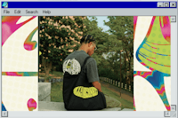 a computer screen showing a person sitting on a bench