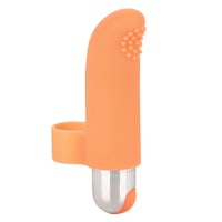 an orange plastic sex toy on a white background