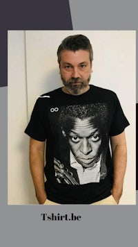 a man wearing a t - shirt with the words t-shirt be