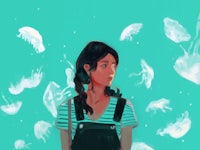 a girl is standing in front of jellyfish