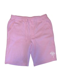 a pink sweat short with a white elephant on it