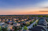 aerial view of a residential neighborhood at sunset