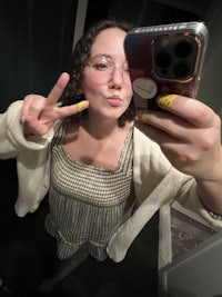 the artist sitting on rocks at sand beach in acadia, maine!! 