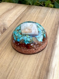 a blue and white sphere on top of a wooden table