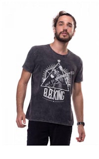 a man wearing a t - shirt that says blk king
