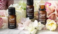 Three diffuser blends amongst flowers and petals