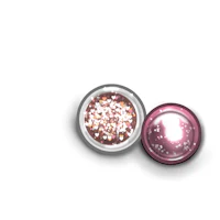 a pink and white glitter ball on a white background