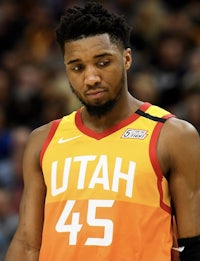 the utah basketball player is looking at the crowd