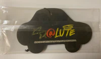 a black car with graffiti on it in a plastic bag