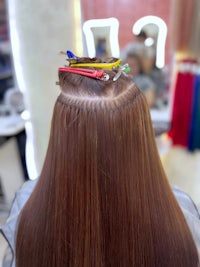 the back of a woman's hair in a salon