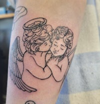 a black and white tattoo of an angel and a baby