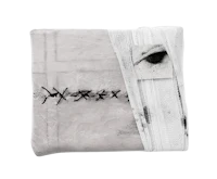 a black and white image of a blanket with an eye on it