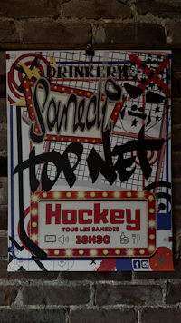 a hockey poster hanging on a brick wall