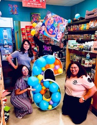 a group of people posing for a photo in a store