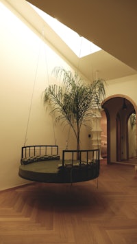 a wooden floor in a room with a swing bed