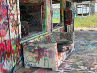 a couch covered in graffiti