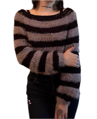 a woman wearing a black and white striped sweater