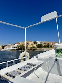 the back of a boat with a view of a small town