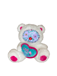 a white teddy bear with a pink heart on it