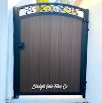 a wooden gate with an ornate design