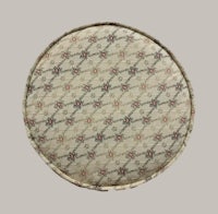 a round cushion with a floral pattern on it