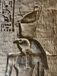 an egyptian relief depicting a bird on a wall