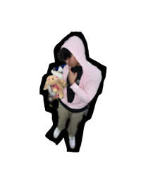 a man in a pink hoodie holding a stuffed animal