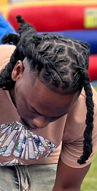 a man with dreadlocks and a t - shirt