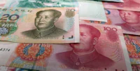 chinese yuan banknotes are stacked on top of each other