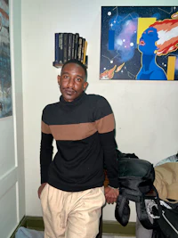 a man wearing a black and brown sweater