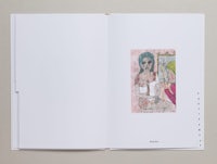 an open book with a drawing of a woman