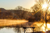 a bench in the middle of a lake