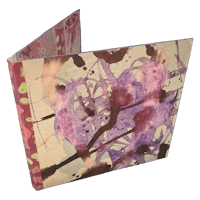 a book with purple and pink paint splatters on it