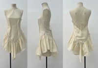 a white dress with ruffles on a mannequin