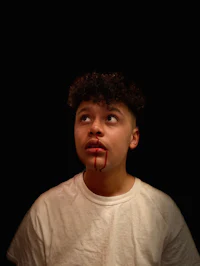 a young man with blood on his face