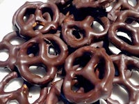 chocolate covered pretzels on a white plate